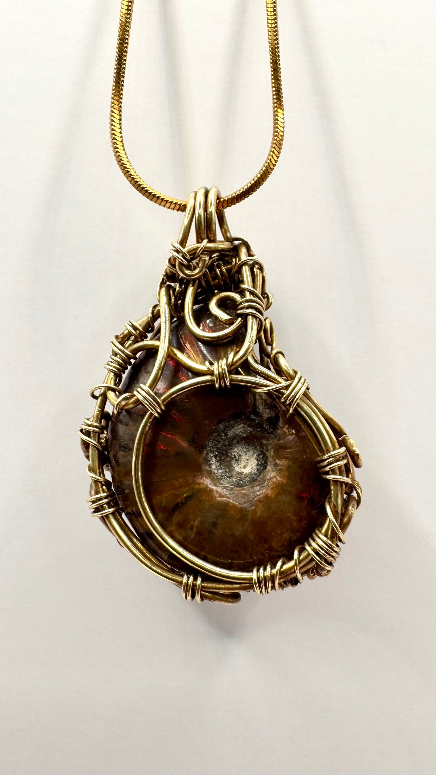 Opalized Ammonite Pendant. Wire wrap.