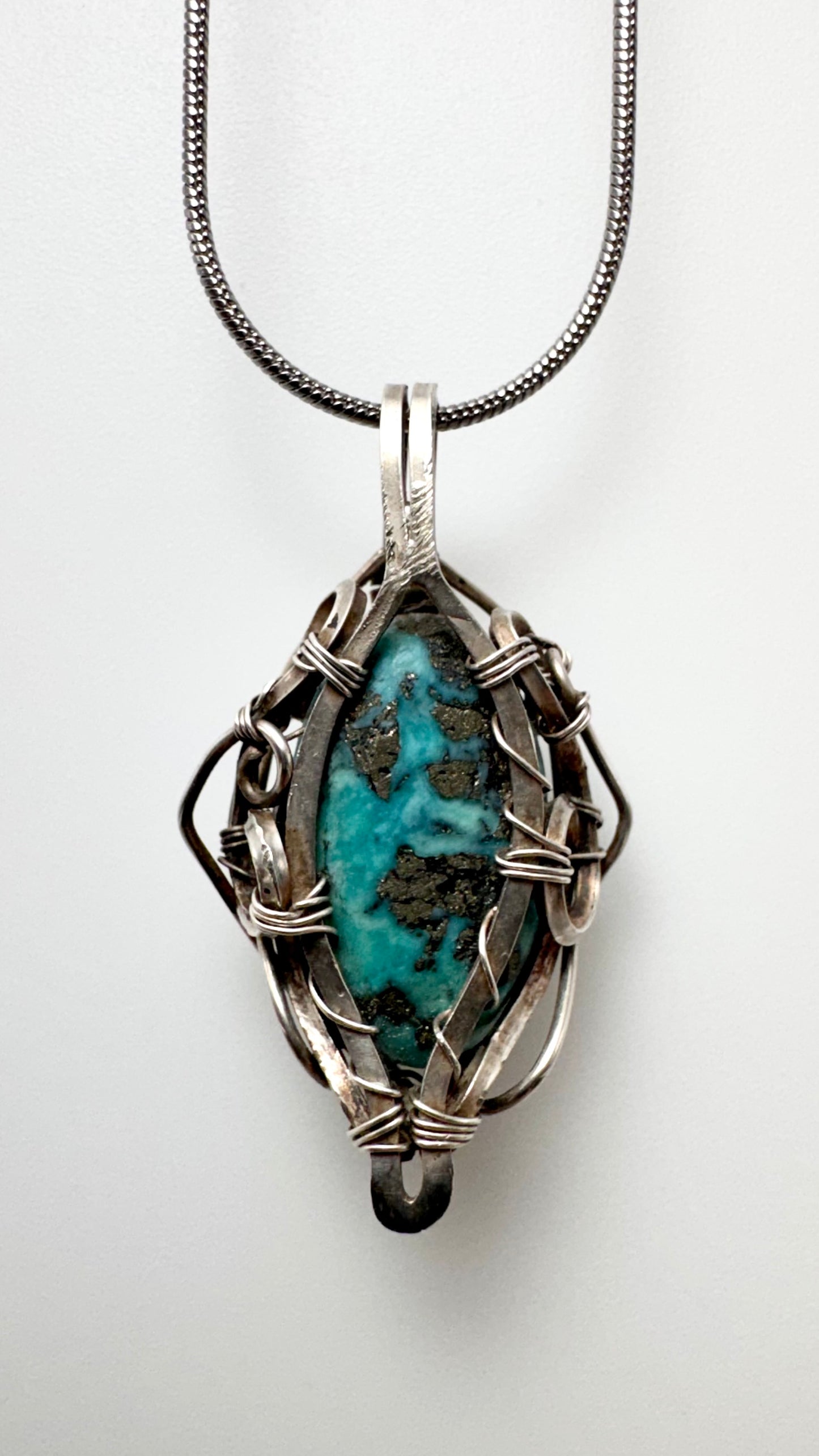 Pakistani Turquoise Pendant. Silver wire wrap.