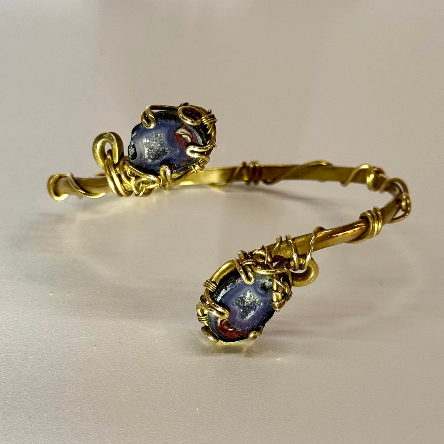 Brass bracelet with two geodes